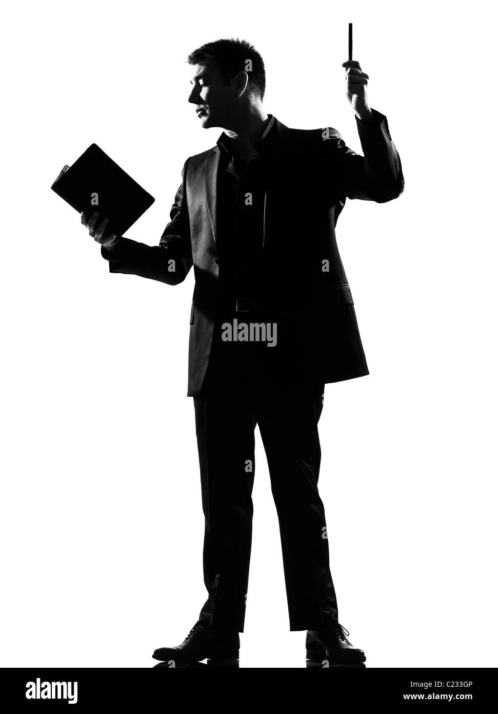 silhouette caucasian business man with note pad expressing behavior full length on studio isolated white background Stock Photo