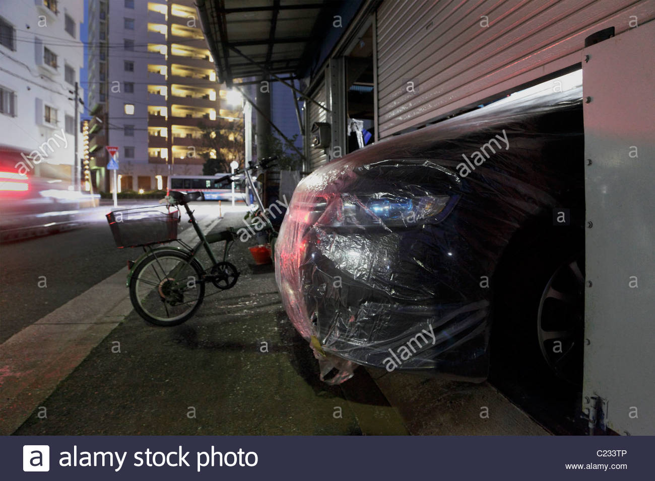 Covered With Plastic Front Of Car Sticking Out Under The