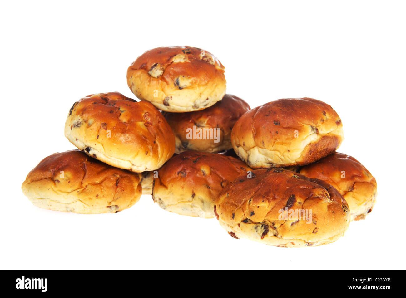 Many bread bun rolls with raisins and currants isolated over white Stock Photo