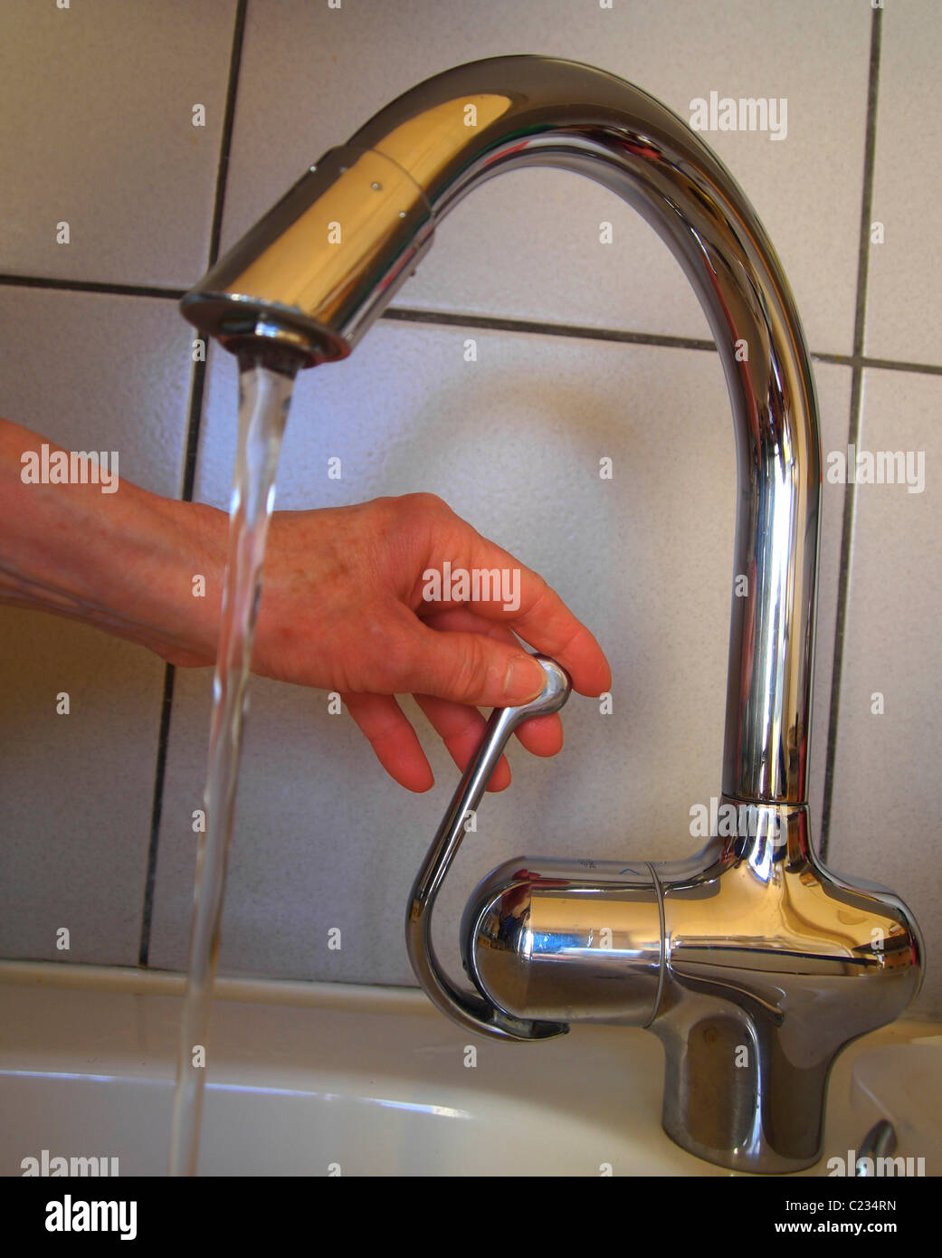 Water flowing of a tap. Stock Photo