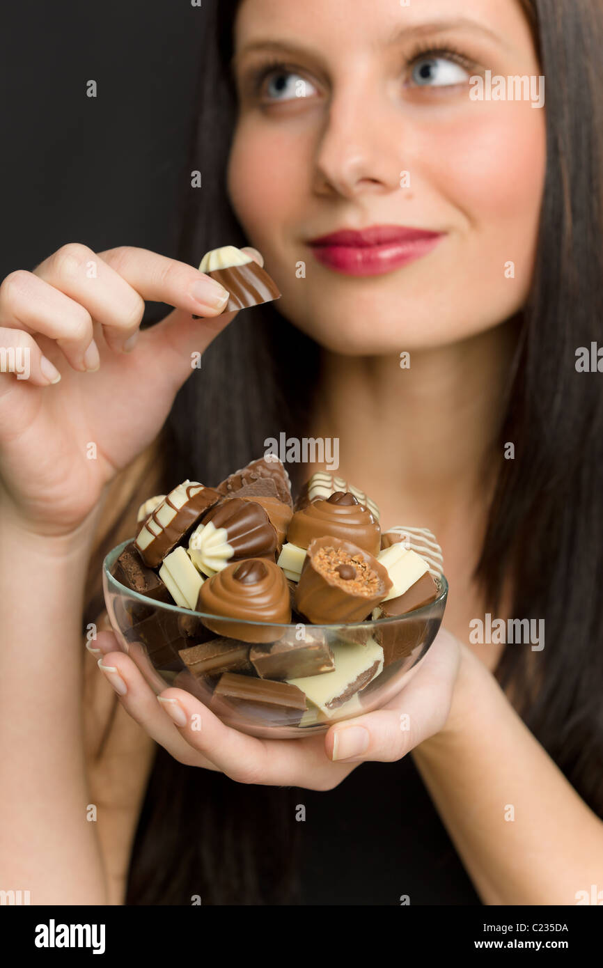 Chocolate Portrait Of Young Woman Enjoy Candy In Bowl Stock Photo Alamy