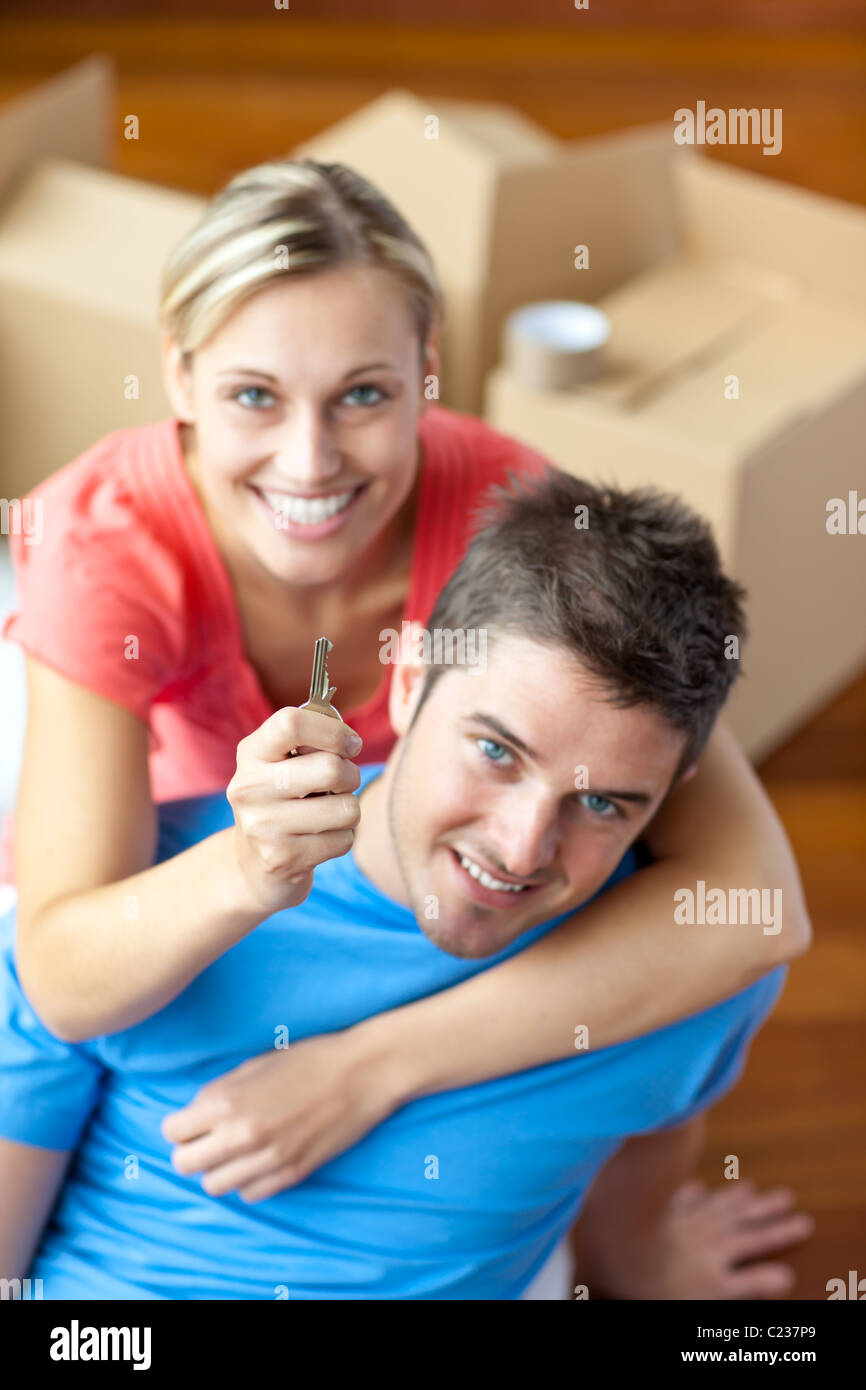 Young couple holding a key Stock Photo - Alamy