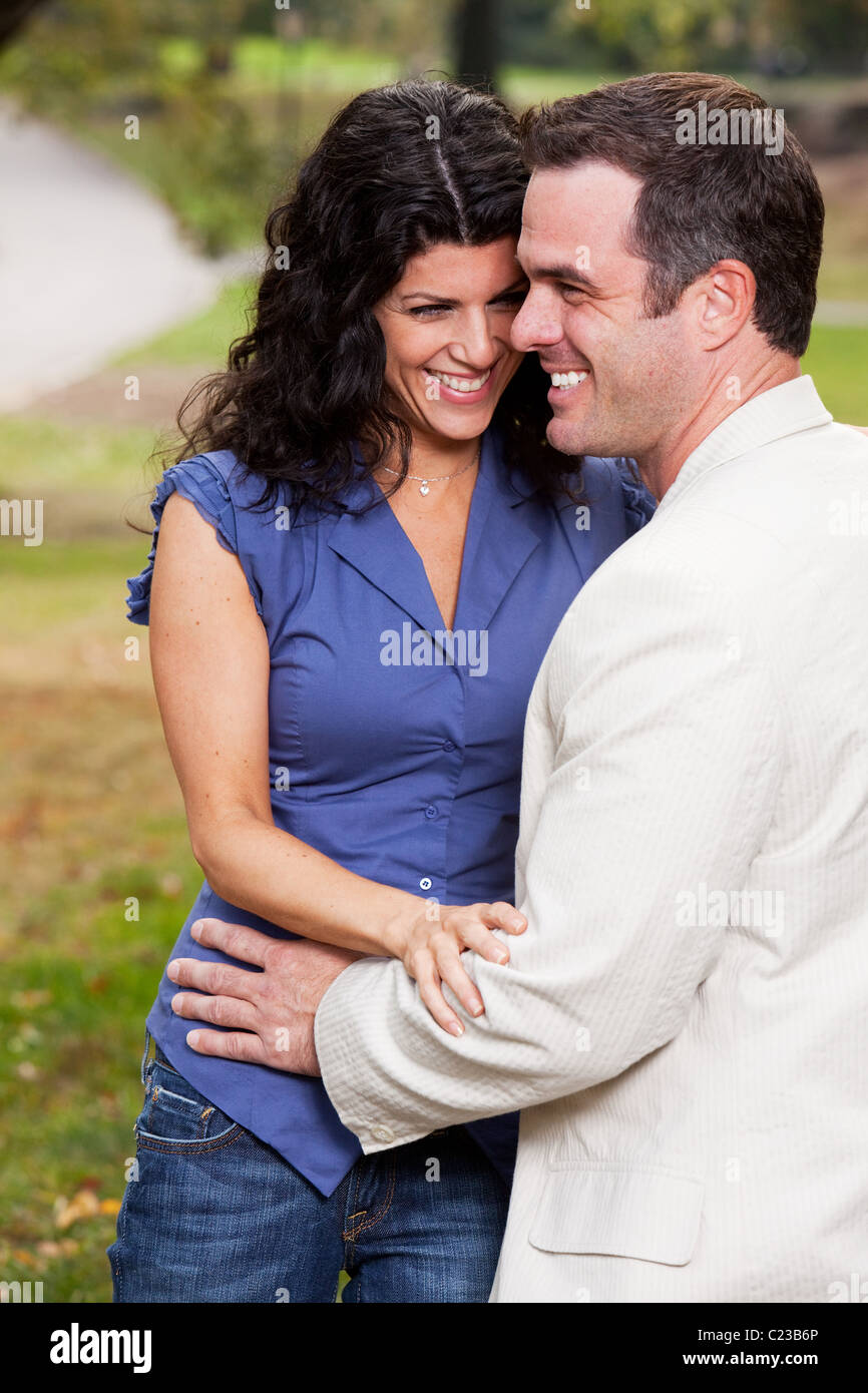 A couple having fun and laughing in the park Stock Photo - Alamy