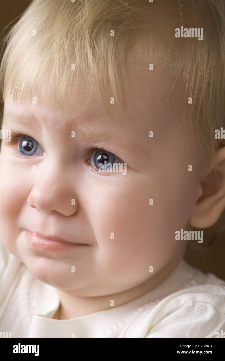 Blonde 14 month old on the verge of tears Stock Photo