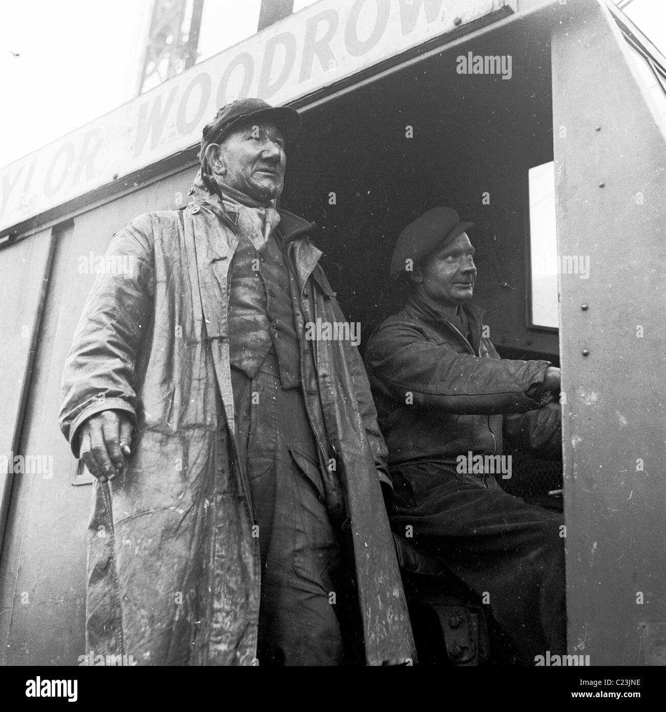 1950s, England. Construction workers for builder Taylor Woodrow in