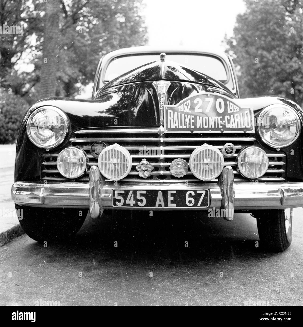 1952, historica, Monte Carlo, view of the front of a luxury Peugeot 203 car, parked in a Monte Carlo  street, taking part in the Rallye Monte-Carlo. I Stock Photo