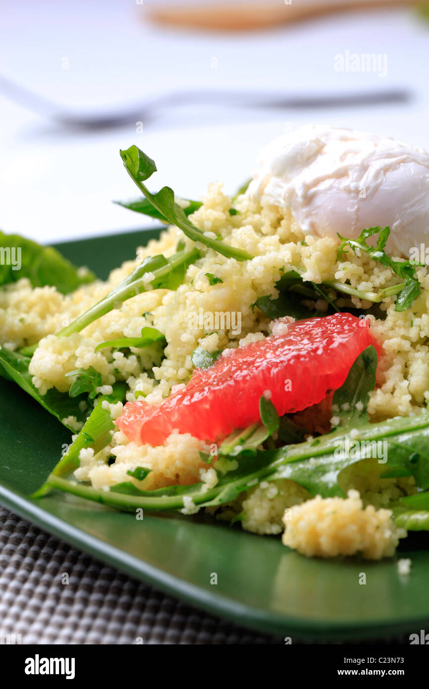 Couscous with red orange and rocket, poached egg on top Stock Photo Alamy