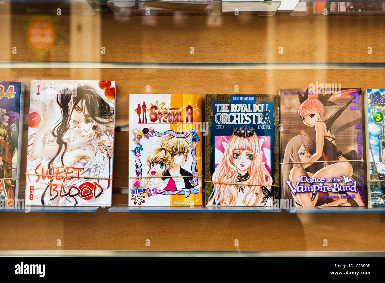 Manga comics and books in a shop window, France, Europe Stock Photo
