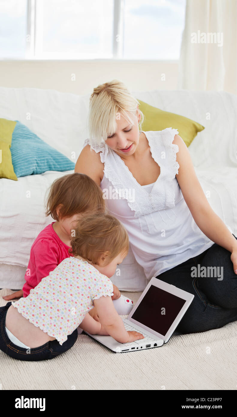 Small family having fun with a laptop Stock Photo