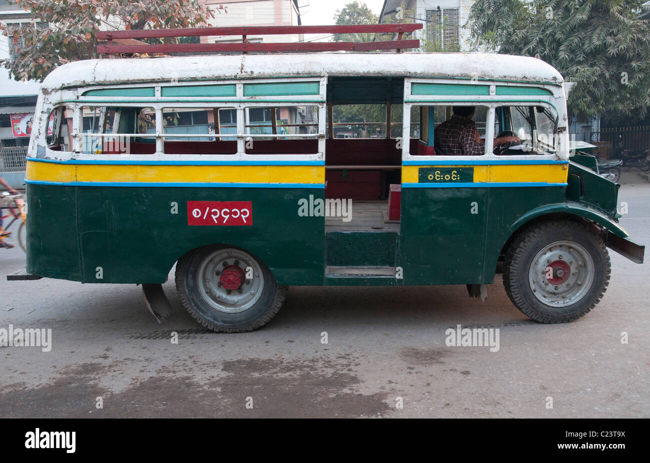 Old british bus in the streets of Mandalay. Myanmar Stock Photo