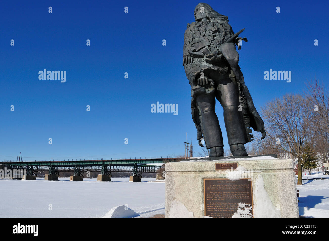 Native American, 'Ekwabet' statue erected on the banks of the Fox River to watch over the waterway St. Charles, Illinois, USA. Stock Photo