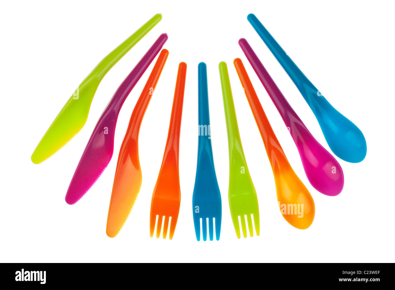 Set of three of each of brightly coloured plastic picnic knives forks and spoons Stock Photo