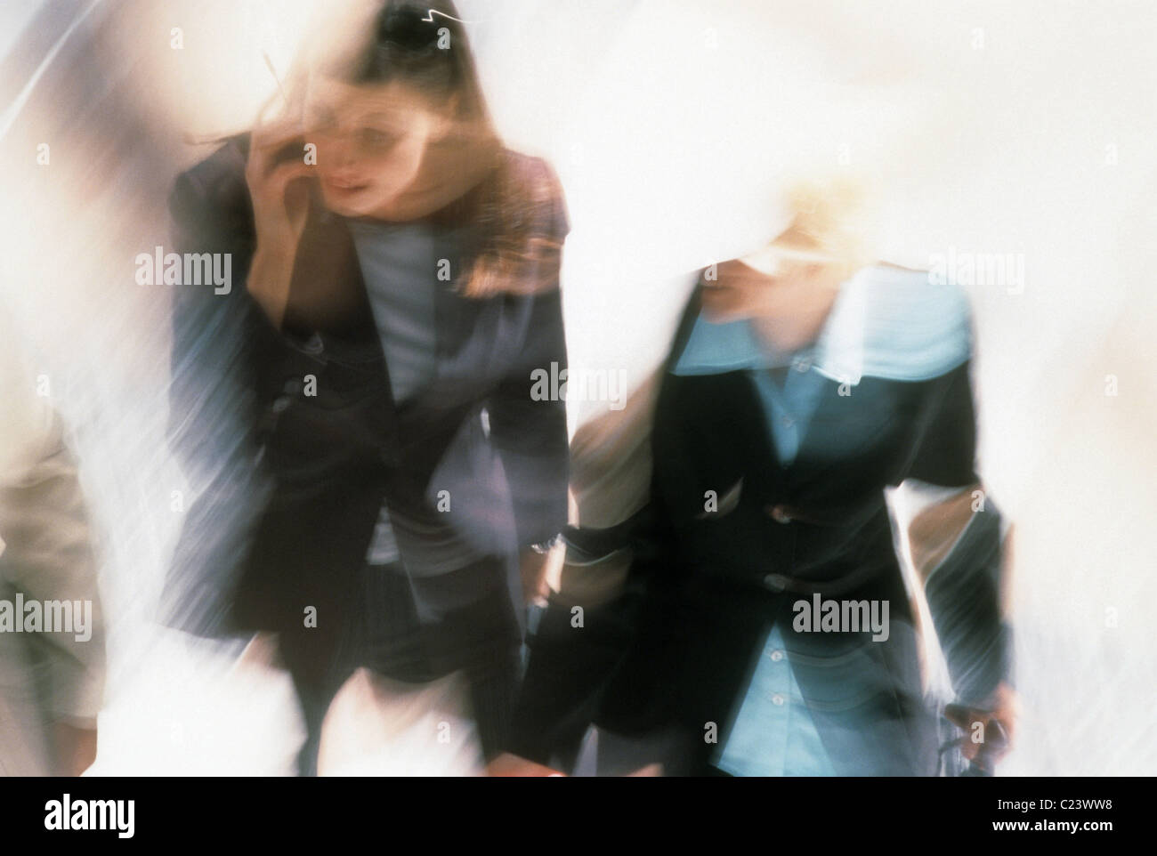 Business women rush to make an appointment or a flight. Stock Photo