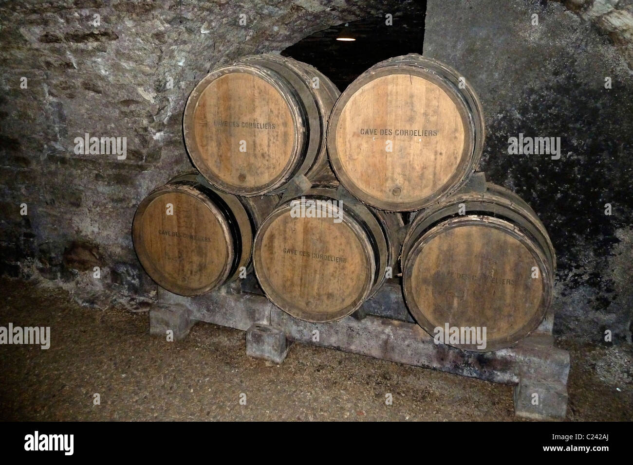 Caves with oak barrels, wine cellars du Couvent des Cordeliers, Beaune France 110078 Chablis Stock Photo