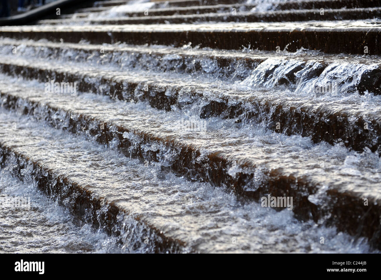 Water pouring down steps during torrential rain in Spain Stock Photo
