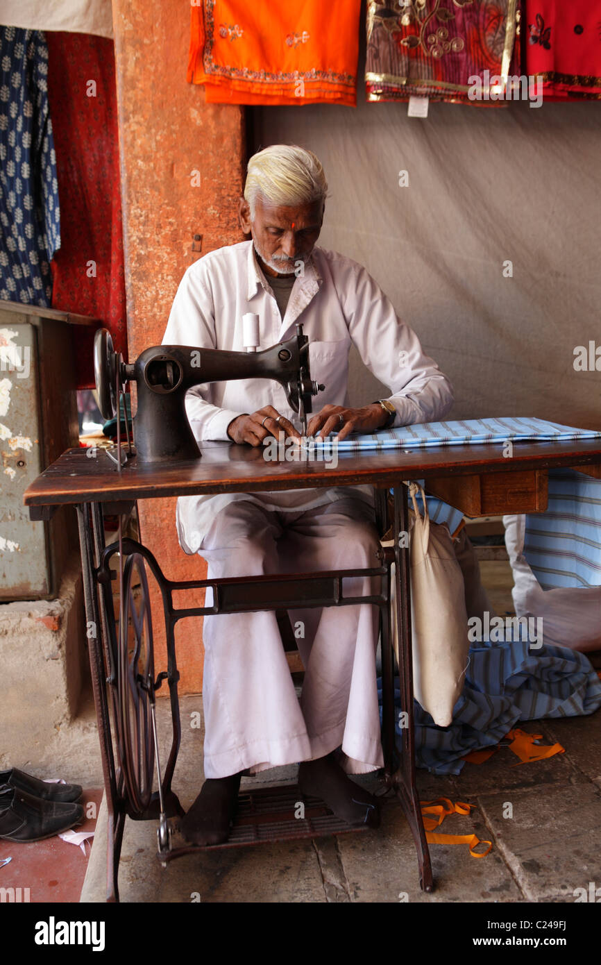 Tailor men sewing garments, Rajasthan, India Stock Photo