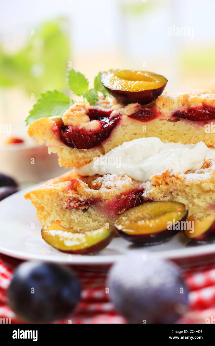 Slices of fresh plum cake with cream Stock Photo - Alamy