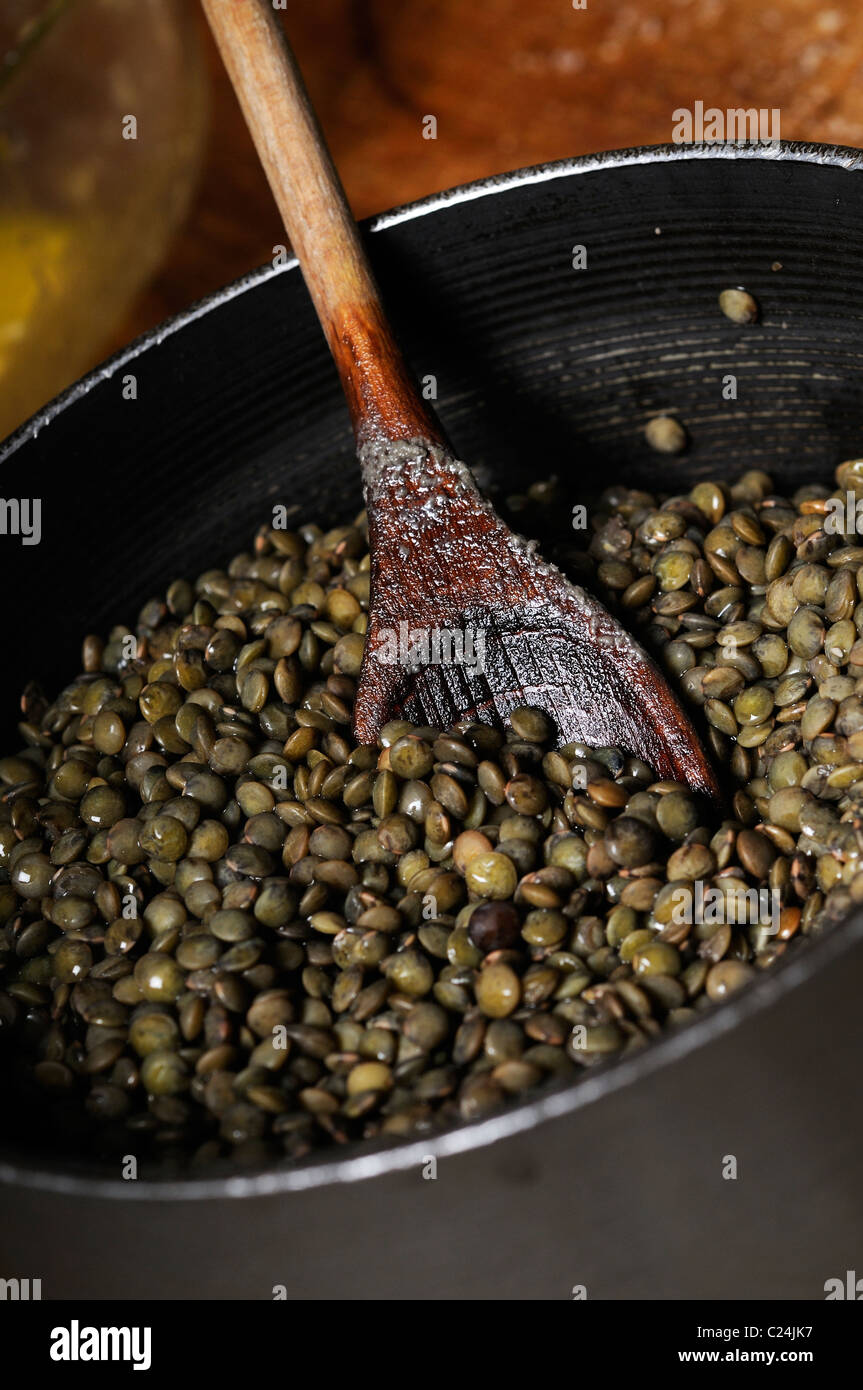 Stock photo of green lentils in a pan. Stock Photo