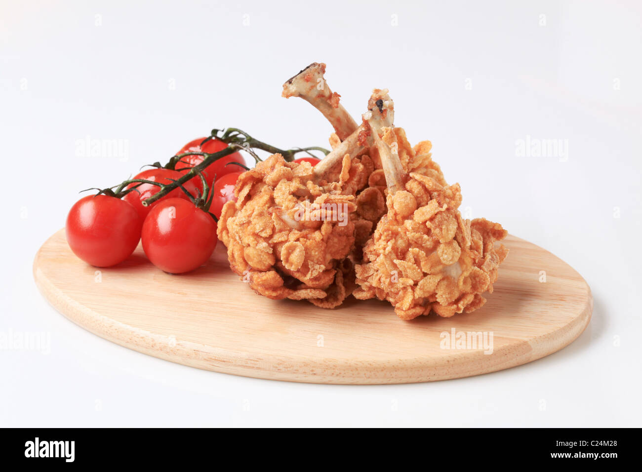 Fried chicken drumsticks coated with corn flakes Stock Photo Alamy