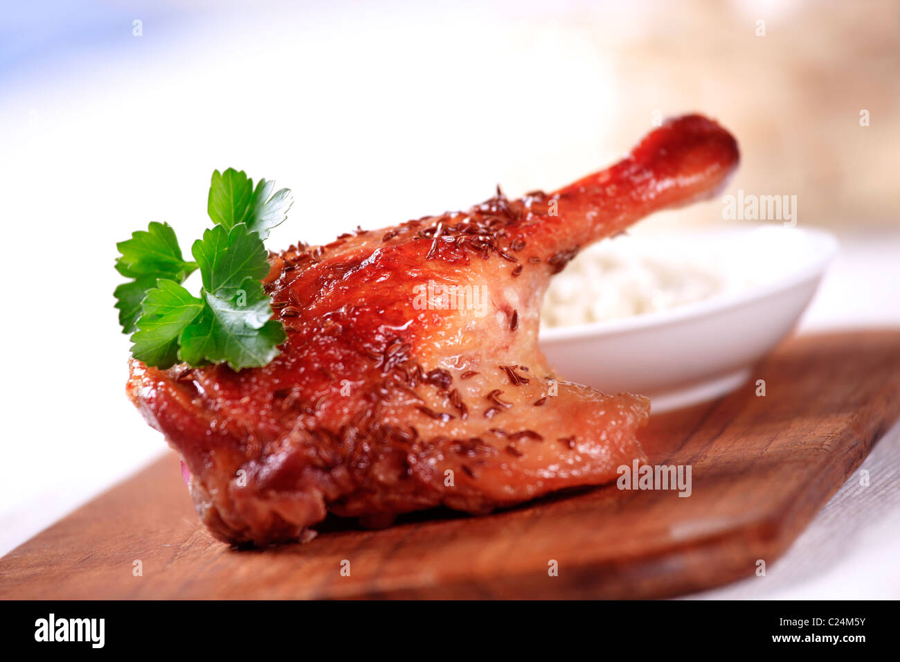 Roast leg of duck sprinkled with caraway seeds Stock Photo Alamy