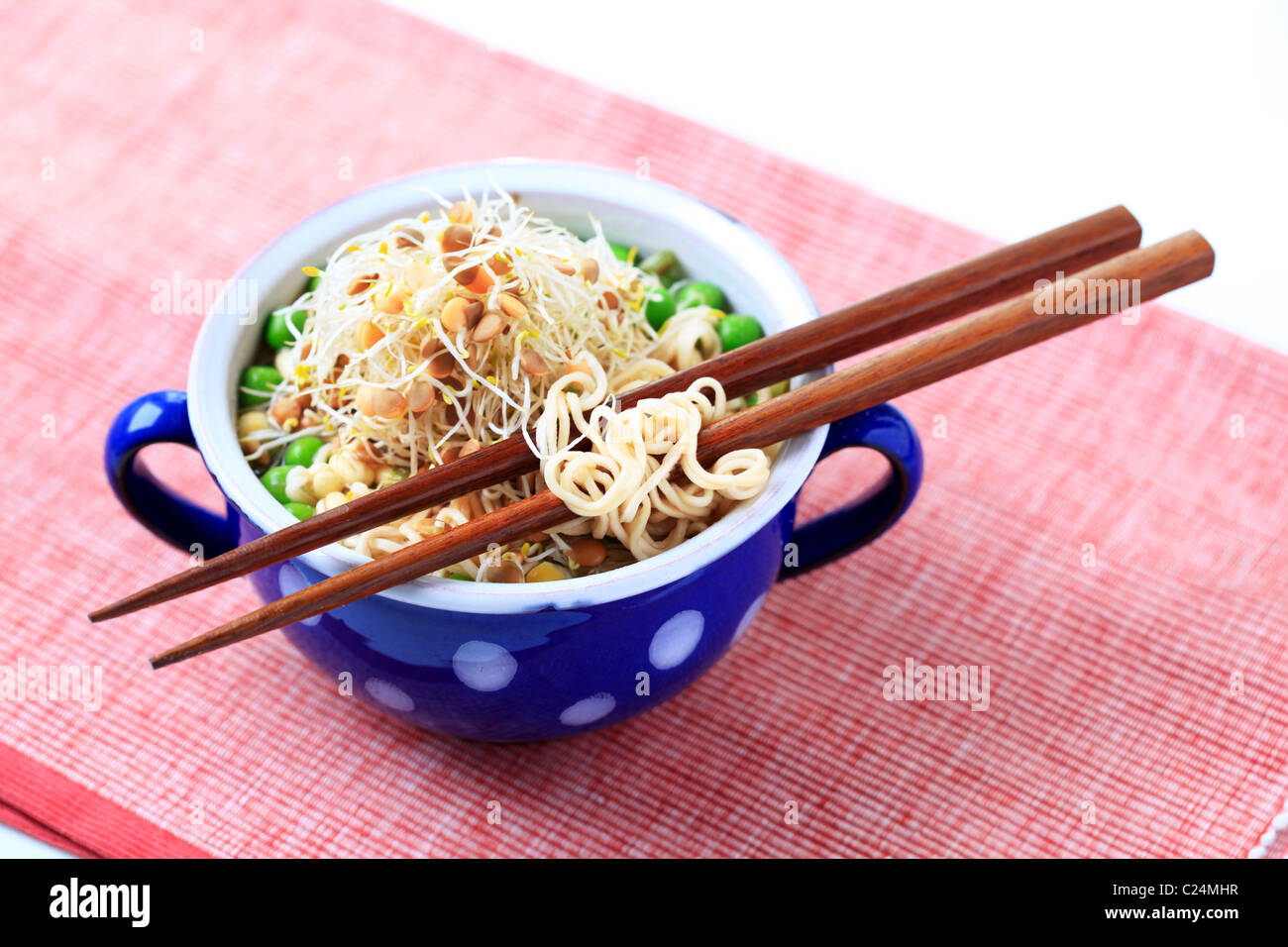 Mug of legume soup with noodles - closeup Stock Photo