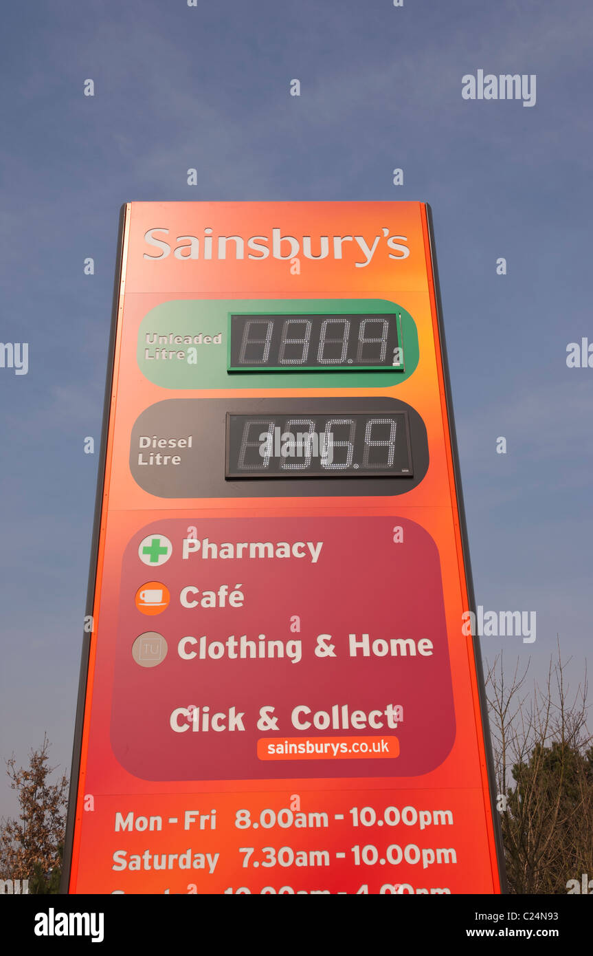 Petrol price sign at Sainsburys filling station at Longwater Retail Park in Norwich , Norfolk , England , Britain , Uk Stock Photo