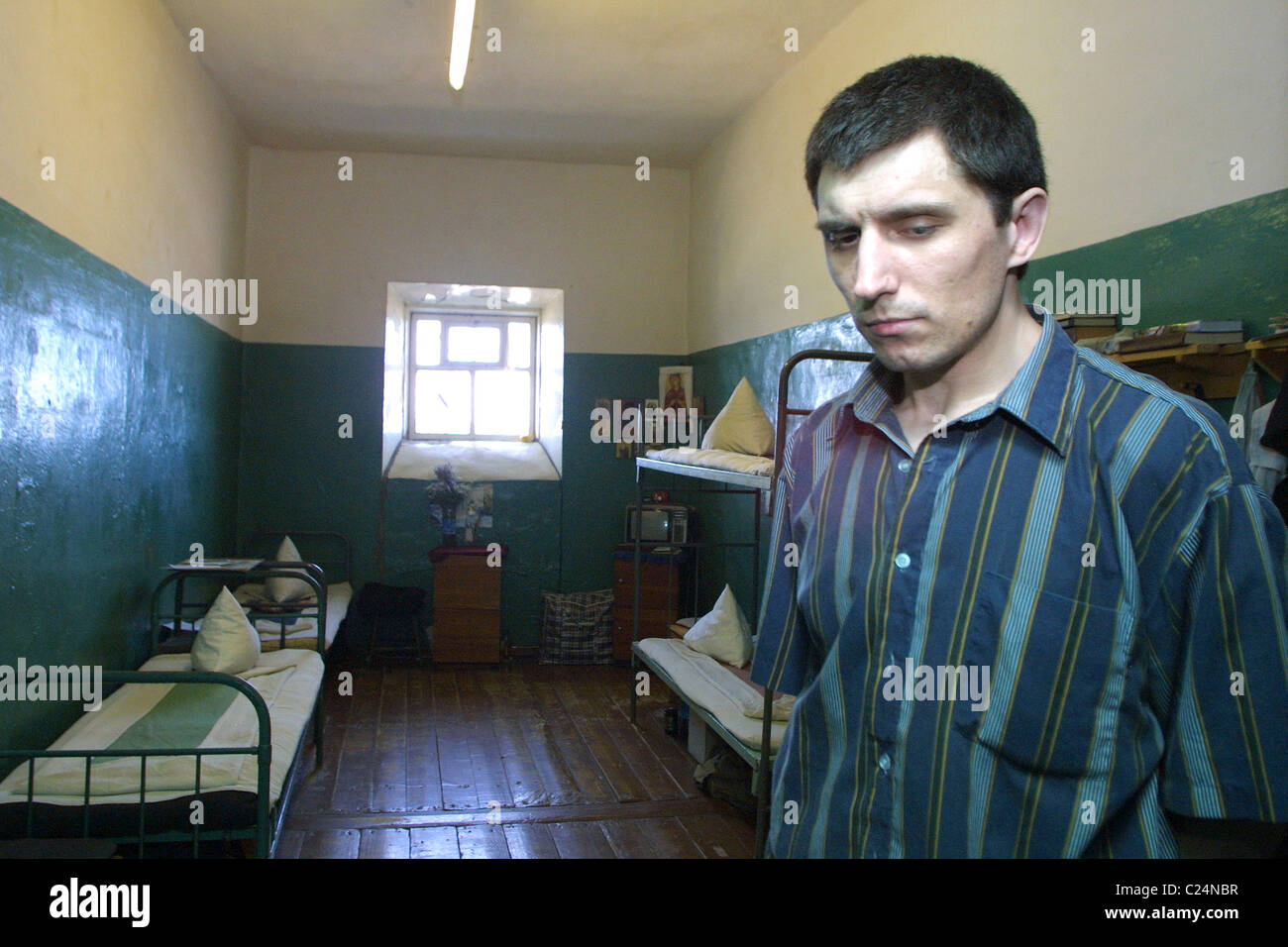 A prisoner in a prison cell where prisoners sleep Ognenny Ostrov is an