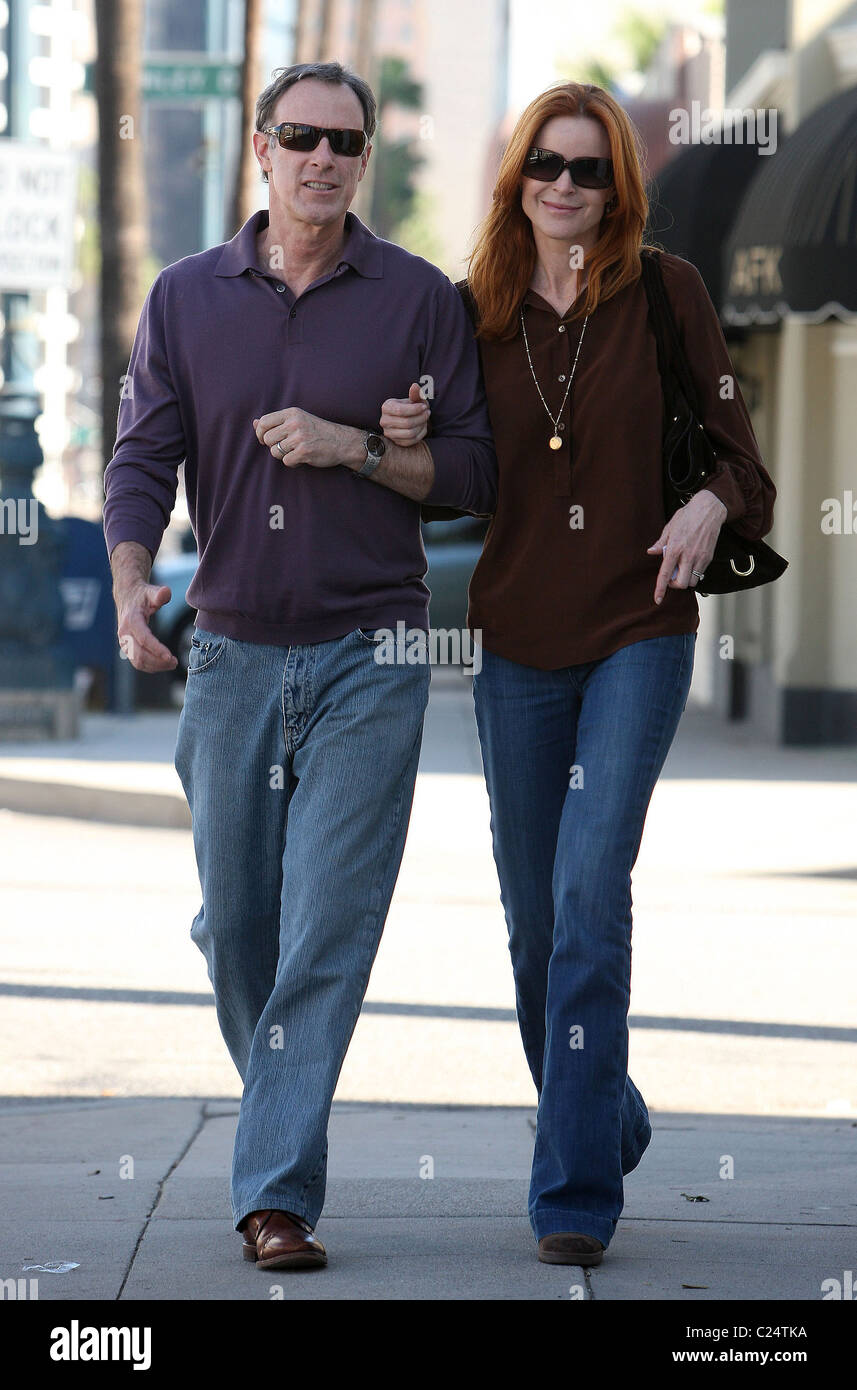 Marcia Cross and husband Tom Mahoney walk back to their car after visiting the AFK Furniture For Children Los Angeles, Stock Photo