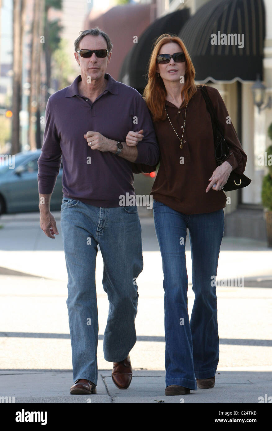 Marcia Cross and husband Tom Mahoney walk back to their car after visiting the AFK Furniture For Children Los Angeles, Stock Photo