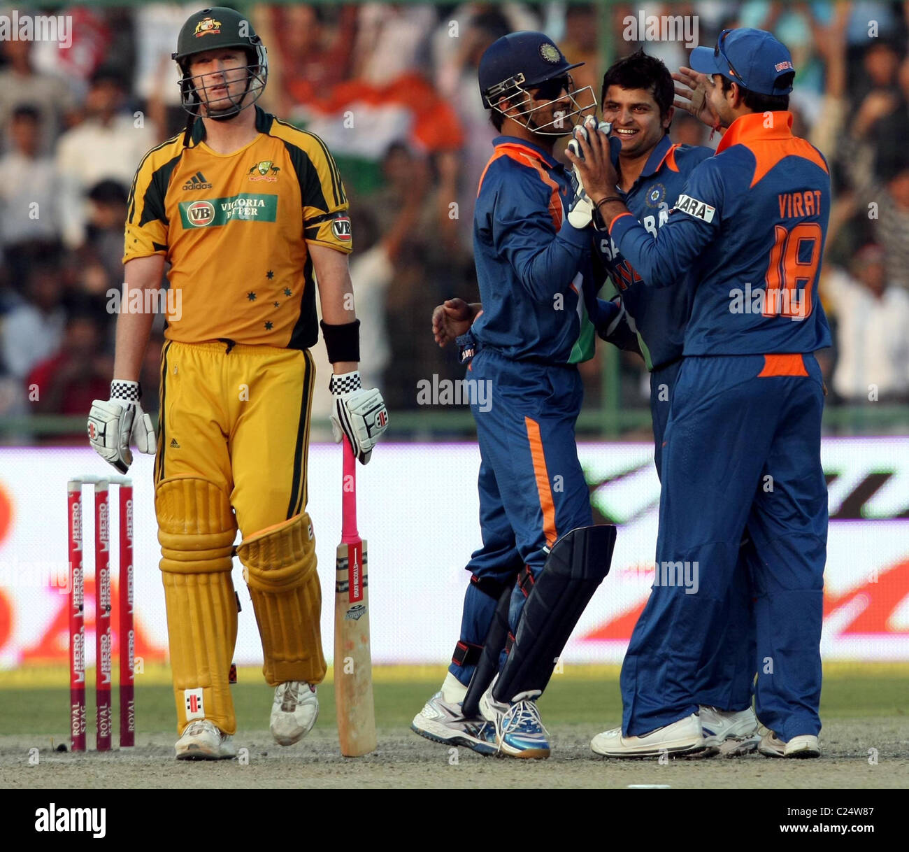 Indian Player MS Dhoni, Suresh Raina and Virat Kholi Celebrates Cameron Whites wicket during the Australia vs India - 3rd ODI Stock Photo