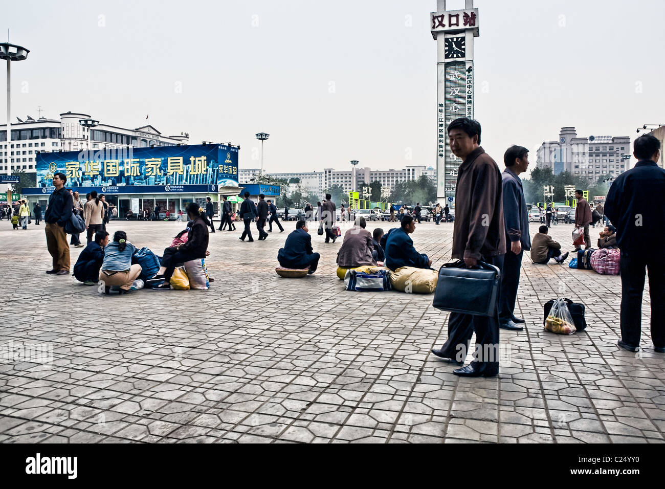 CHINA, WUHAN: Hankou Railway Station in Wuhan with plaza and people waiting for trains with their luggage. Photo Illustration. Stock Photo