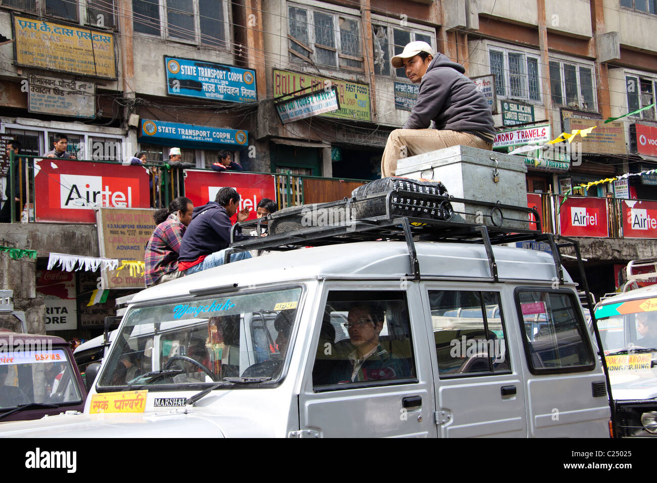 Shared taxis await passengers to nearby towns at Chowk Bazar taxi stand in Darjeeling, West Bengal, India. Stock Photo