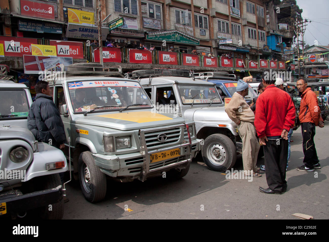 Shared taxis await passengers to nearby towns at Chowk Bazar taxi stand in Darjeeling, West Bengal, India. Stock Photo