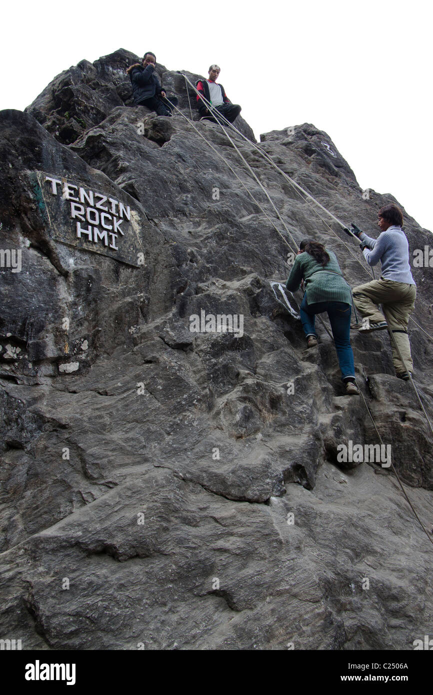 Trainees of the Himalayan Mountaineering Institute at the Tenzing rock in Darjeeling, West Bengal, India. Stock Photo