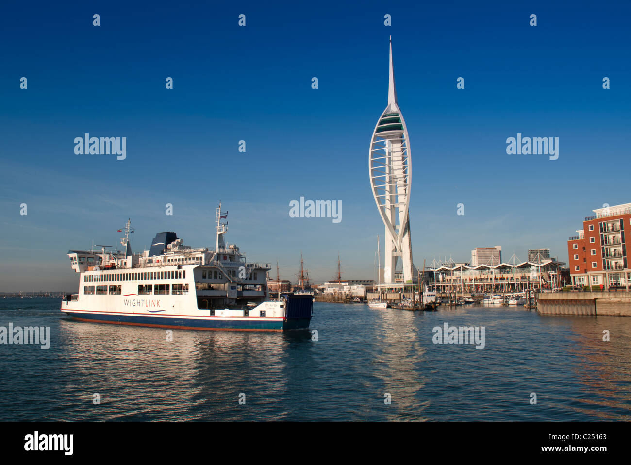 isle of wight ferry in portsmouth harbour by the spinnaker tower Stock Photo