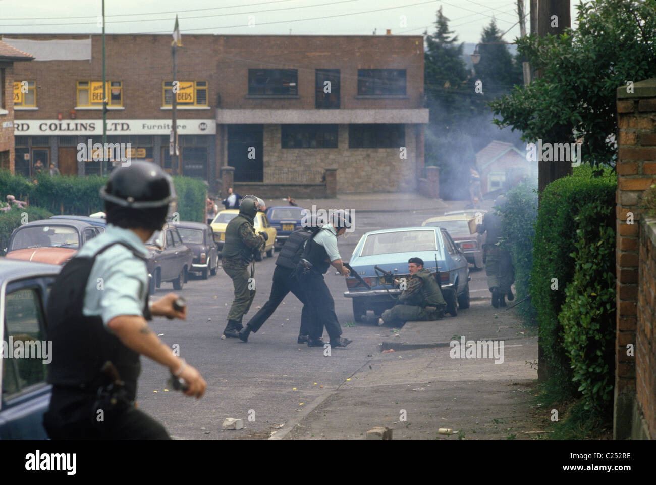 The Troubles. 1980s Belfast Northern Ireland. RUC and British Army under attach from catholic
