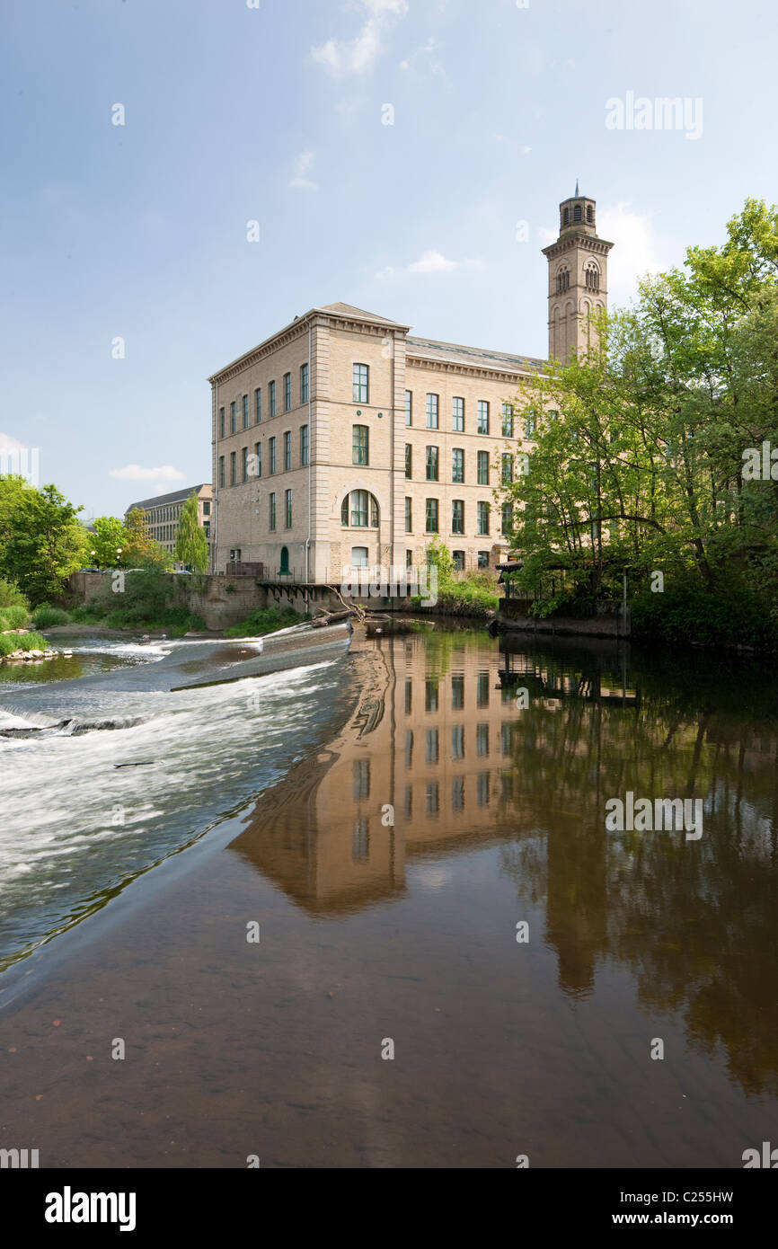 Looking across the weir towards Salts Mill in Saltaire, Yorkshire, UK Stock Photo