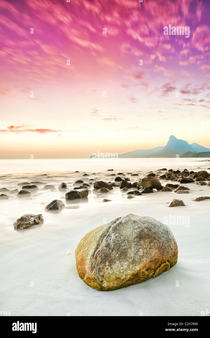 Sunrise over the sea. Stone on the foreground Stock Photo