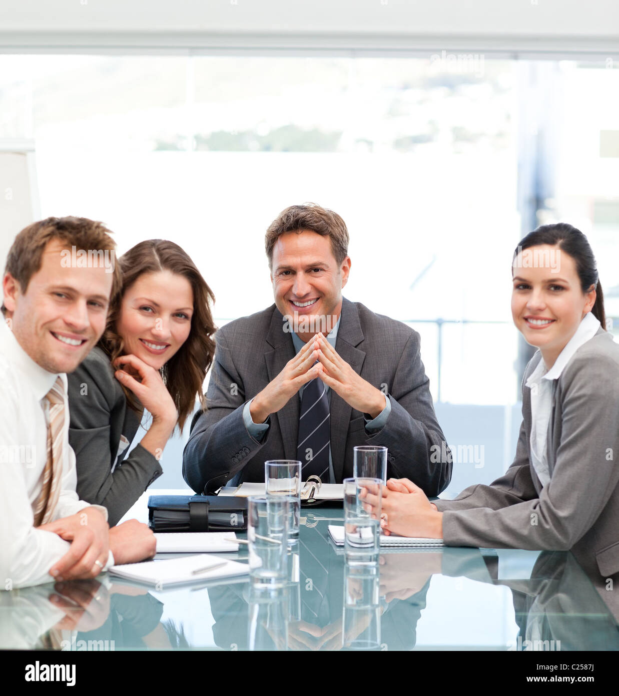 Helpful Manager Portrait of a positive manager with his team Stock Photo - Alamy