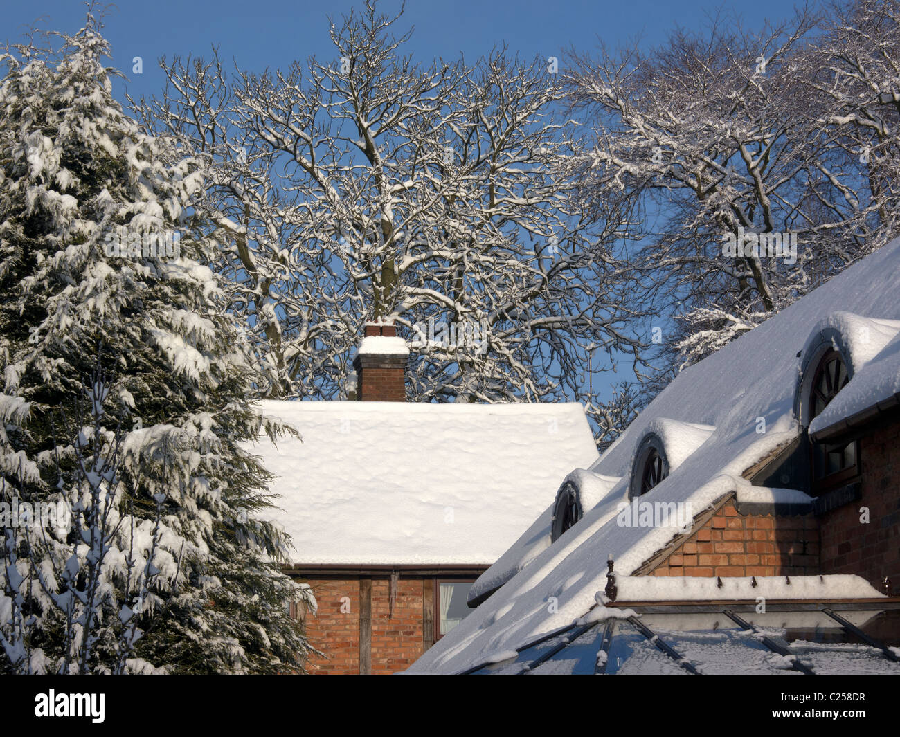 A snow covered rural landscape in a village Stock Photo - Alamy