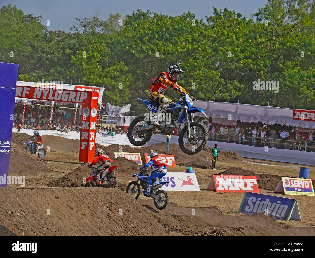 Motocross rider performing a jump on a motorcycle, Pune, Maharashtra