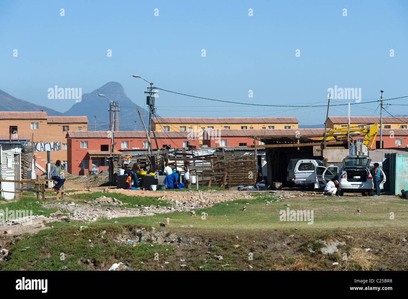 Shacks and new housing along Vanguard Drive, Epping, Cape Town, South Africa Stock Photo