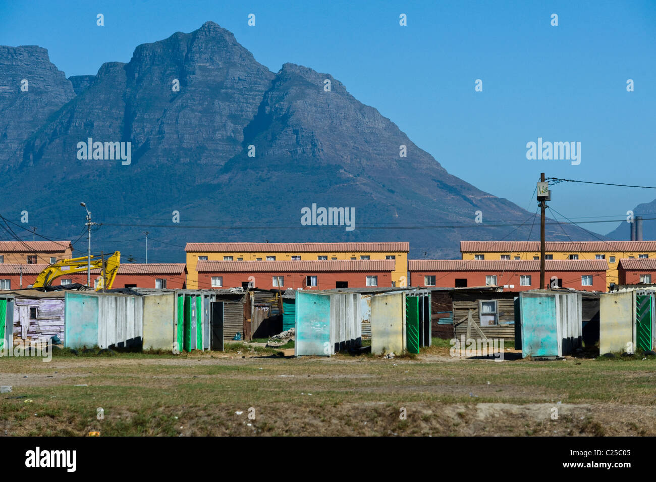 Public toilets, shacks and new housing along Vanguard Drive, Epping