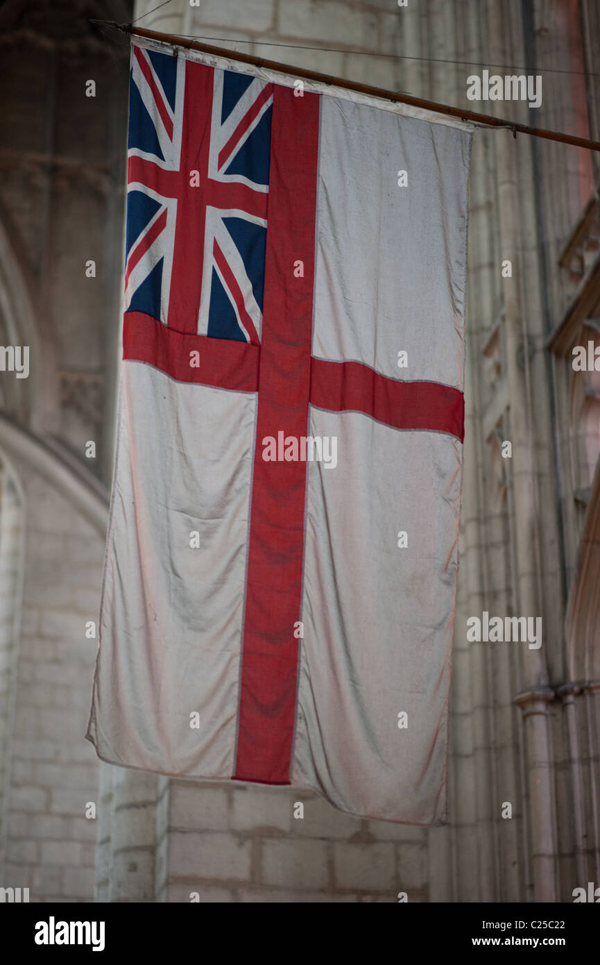 Historic British  White Ensign flag hanging in Cathedral Stock Photo