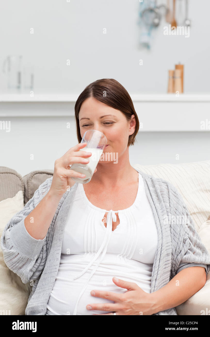 Pregnant woman drinking milk Stock Photo Alamy