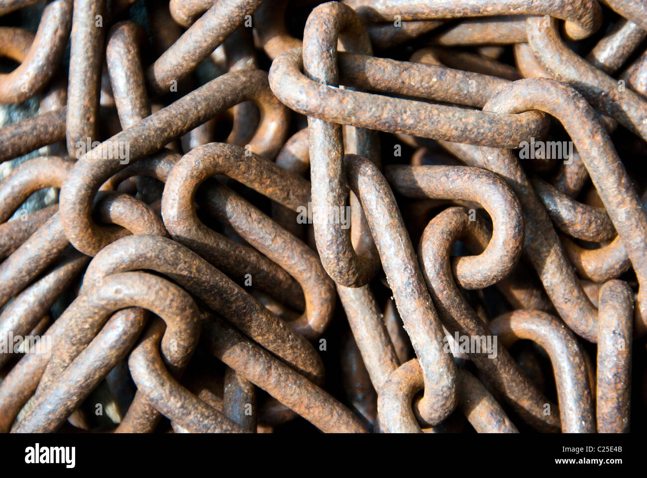 Closeup on a pile of rusty old obsolete chain Stock Photo