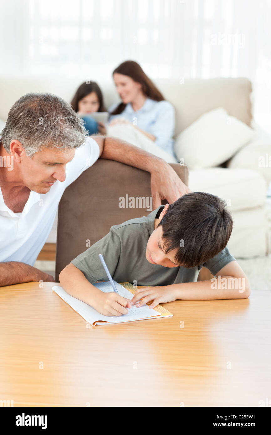 Father helping his son with his homework Stock Photo - Alamy