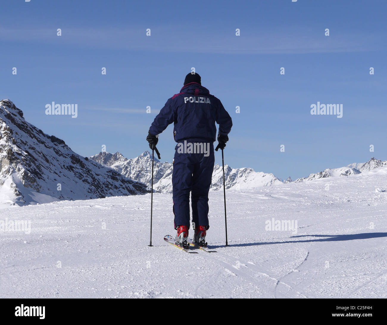 Italian ski piste police checking long ski down to Val Tournache, Italy from Cervinia Stock Photo