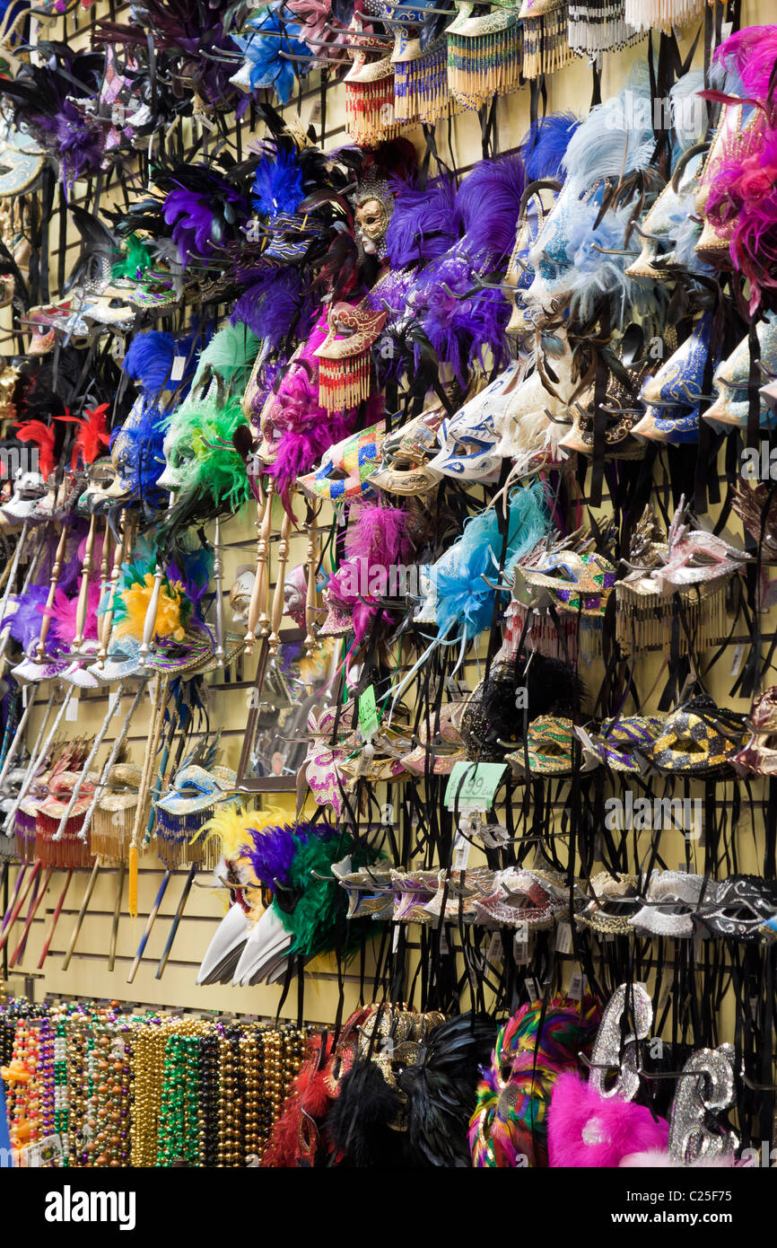 Mardi gras masks and beads for sale on display at a store in the French
