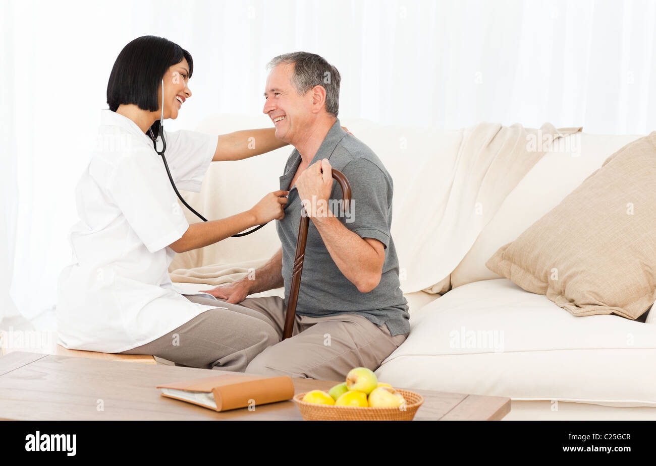 Retired man with his nurse Stock Photo - Alamy